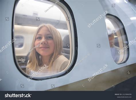 Portrait Happy Girl Looking Out Airplane Stock Photo 2123994290 ...