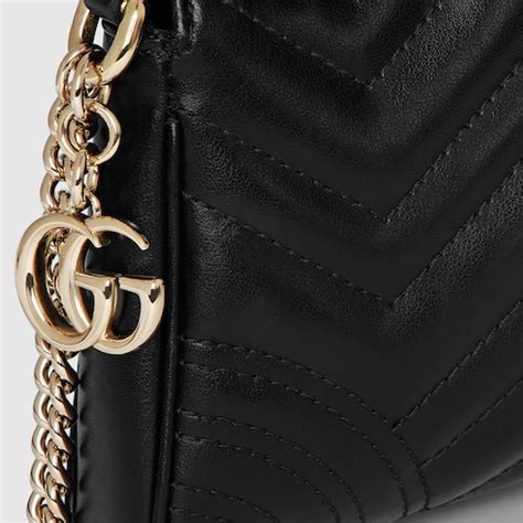 GG Marmont small shoulder bag in black leather | GUCCI® SG
