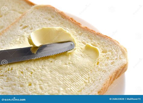 A Knife Spreading Butter on Bread. Stock Photo - Image of homemade ...