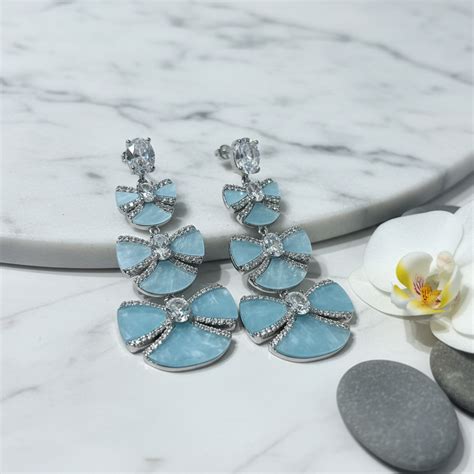 Silver CZ Triple Bow Drop Earrings in Powder Blue | Parler De Perles