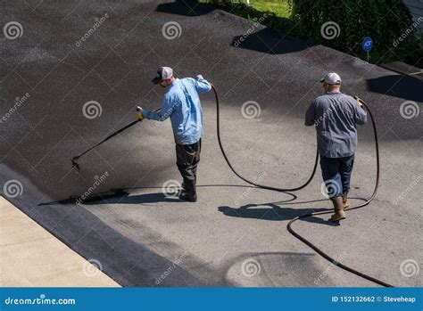 Workers Spraying Blacktop or Asphalt Sealer Onto Roadway Editorial ...