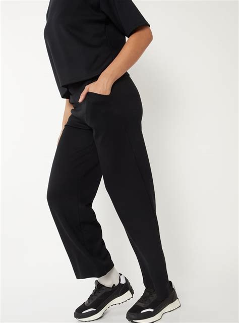 Buy Women Solid Flared Track Pants Online at just Rs. 999.0 ...