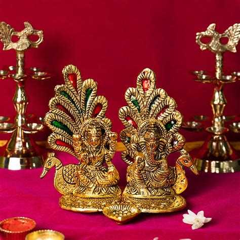 Buy Peacock Ganesh Laxmi Idol with Diya Online in India - Mypoojabox.in