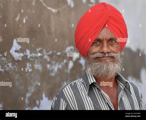 Elderly Indian Sikh man with red Sikh turban (dastar) and short full ...
