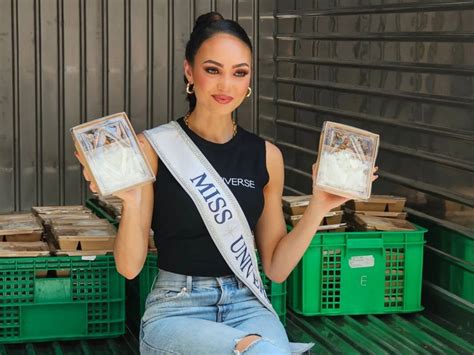R'Bonney Gabriel distributes packages to the people of Wat Phraya Krai ...