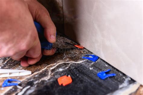 Image result for How to Remove Clips From Tile Leveling System