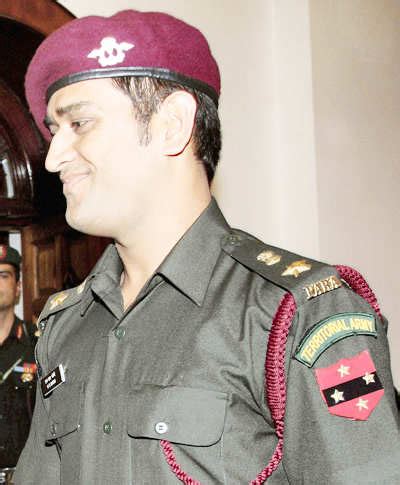 Cricketer MS Dhoni during the pinning ceremony following grant of ...