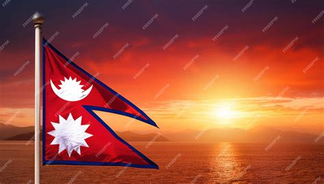 Nepal Flag Waving in Front of a Dramatic Red Sunrise Sky | Premium AI ...