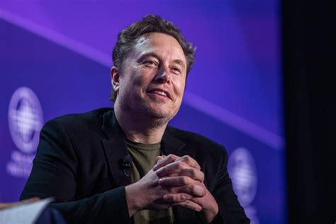 Elon Musk speaks during an interview with head of TED Chris Anderson (out of frame) at the TED2022:
