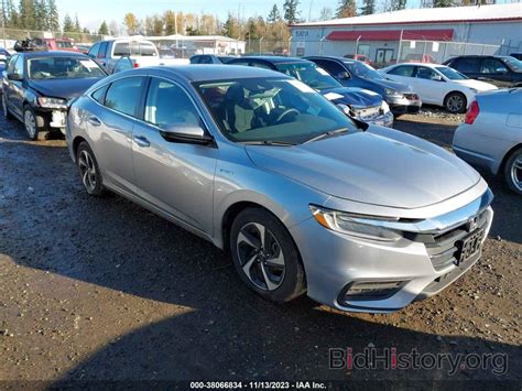 Report 19XZE4F59NE009393 HONDA INSIGHT 2022 Silver Hybrid - price and damage history