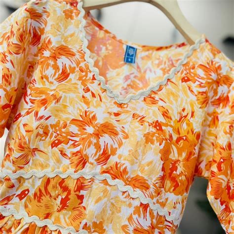 Women’s Orange & Yellow Floral Printed V-Neck Peplum Top with Short Sl