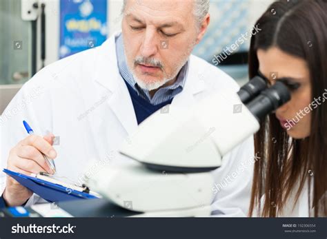 Person Using Microscope 的图像结果