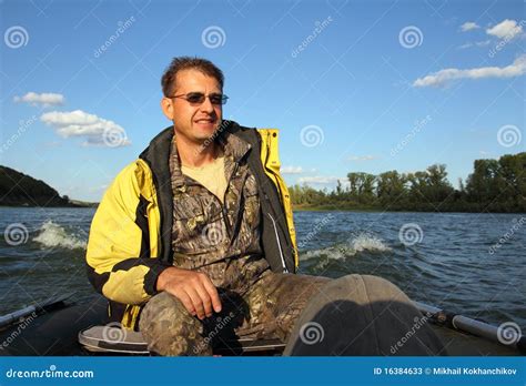 Men on boat with motor stock image. Image of coastline - 16384633