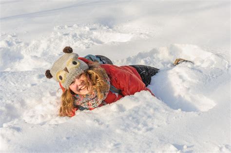 Premium Photo | Young girl playing in snow