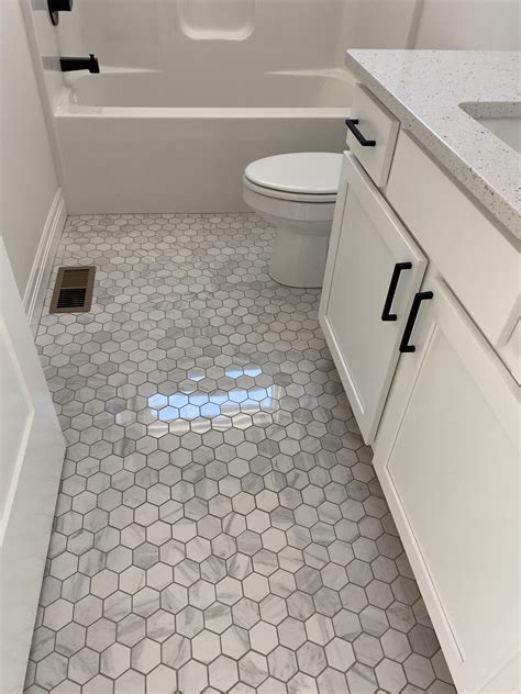 Elegant White Bathroom with Hexagonal Tile Flooring