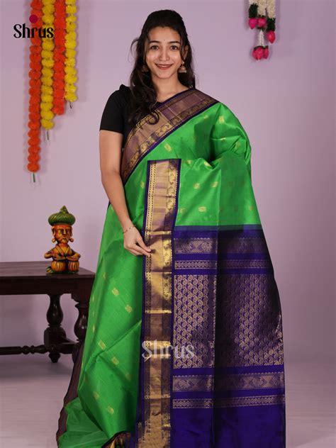 Serene Green & Blue Silk Cotton Saree with zari peacock buttas & zari