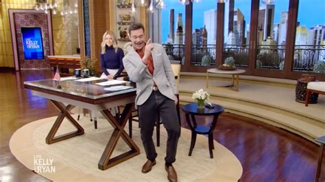 Ryan Seacrest goes off script as he jumps out of seat to show off ...