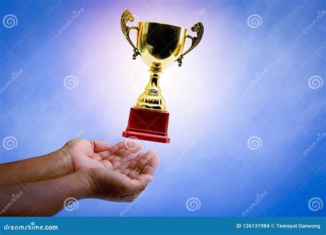 Hands and Golden trophy. stock photo. Image of computer - 126131984