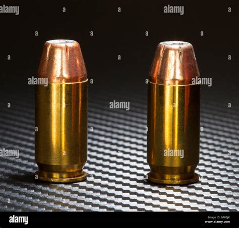 Hollow point bullets on top of cartridges for a forty five caliber ...