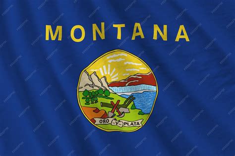 Premium Photo | Montana us state flag with big folds waving close up ...