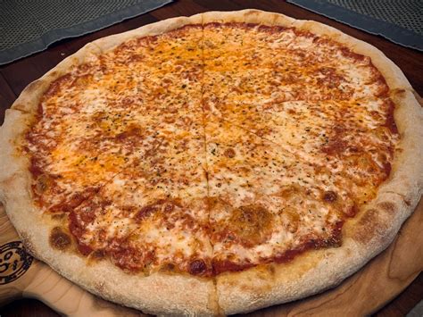 Basic 16-inch NY style pizza cooked in a regular home oven. : r/Pizza