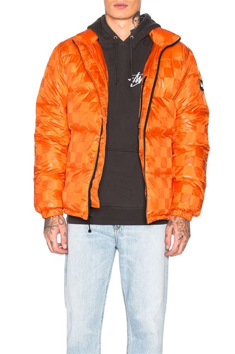 Stussy Puffer Jacket in Orange | REVOLVE