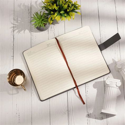 Elegant Gray Leather Notebook with Decorative Border and Strap Closure ...