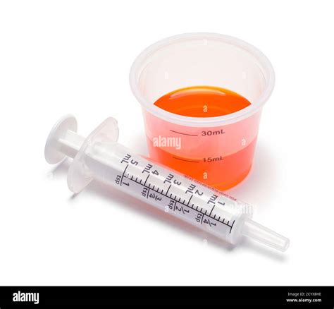 Liquid Medicine in Cup with Oral Syringe Stock Photo - Alamy