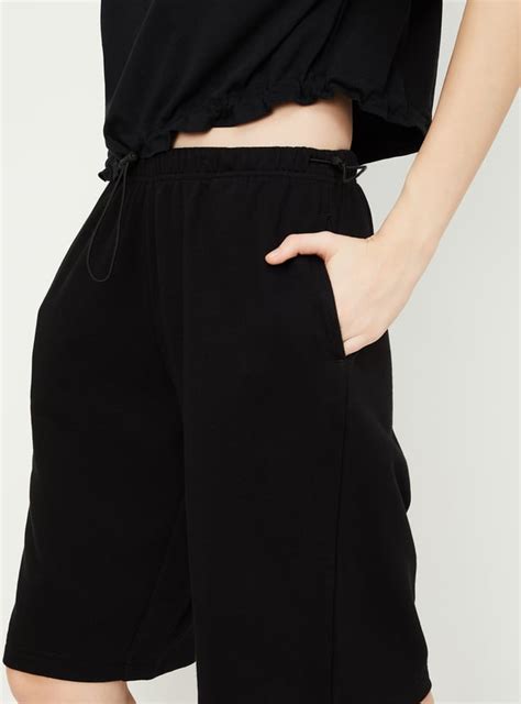 Buy Women Solid Athleisure Bermuda Shorts Online at just Rs. 599.0 ...