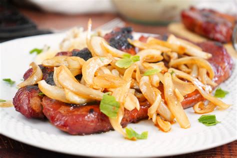 Smoked Pork Steaks with Beer Braised Onions • Smoked Meat Sunday