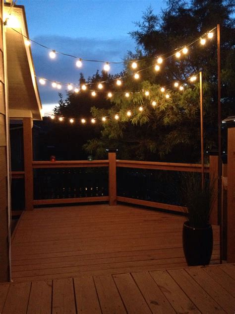 Garden string lights on the back deck | Outdoor deck lighting, Patio ...