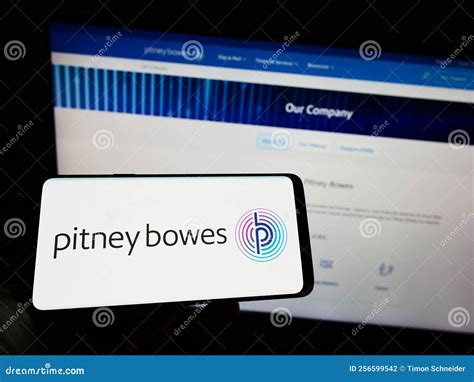 Person Holding Cellphone with Logo of US Technology Company Pitney ...
