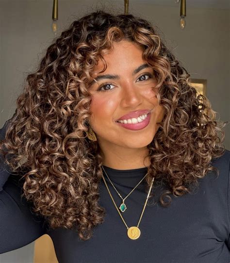 Curly Hair With Caramel Highlights Is 2025's Most Wanted Style