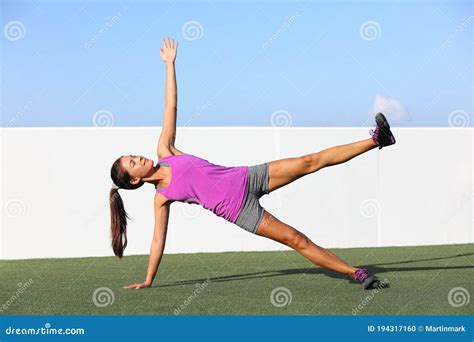 Yoga Woman Planking Doing Side Plank Leg Lift Core Exercise at Fitness ...