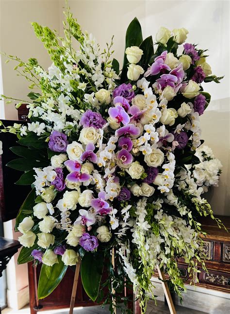 Standing funeral spray white and lavender roses and orchids by Westlake ...