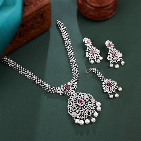 Rhodium Plated Necklace Set With Pink Color Stones And Pearl Drops Sty
