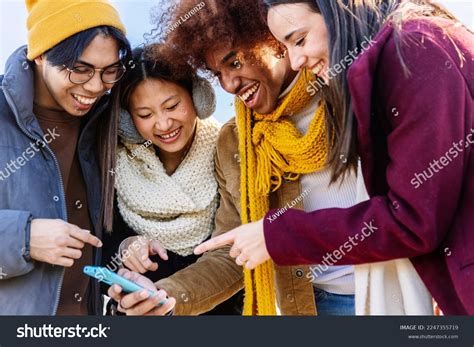 Multiracial Friends Laughing Watching Social Media Stock Photo ...