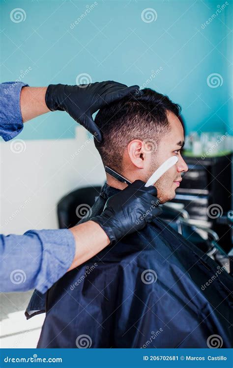 Latin Barber Shop, Mexican Barber Cutting Hair with a Clipper Machine ...