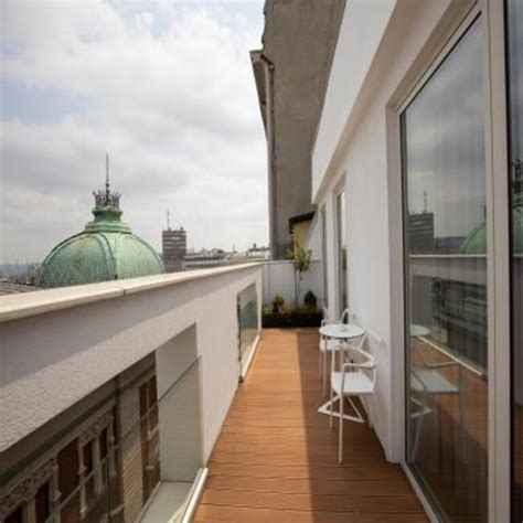 Contemporary Balcony Design With Floor-To-Ceiling Wooden Panelling