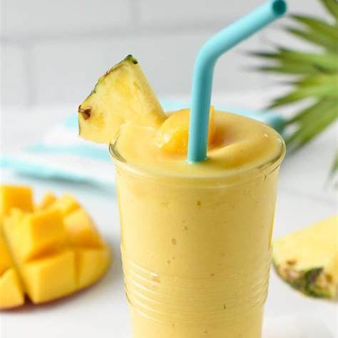 https://www.theconsciousplantkitchen.com/wp-content/uploads/2022/07/Mango-Pineapple-Smoothie-1055x1536.jpg