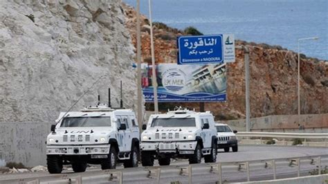 FILE PHOTO: United Nations peacekeepers (UNIFIL) and Lebanese army soldiers stand guard at a checkpoint in Naqoura, near the Lebanese-Israeli border, southern Lebanon, October 27, 2022. REUTERS/Aziz Taher/File Photo