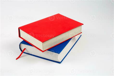 closed red and blue books on a reflecting white background 25743967 ...