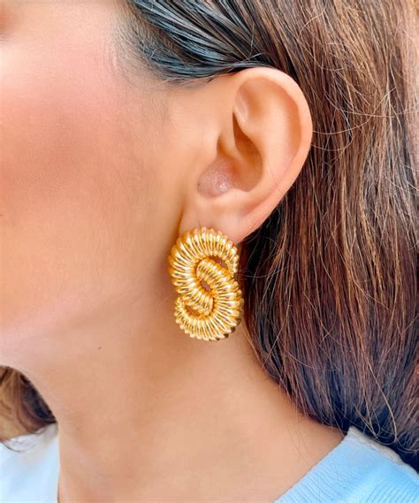 Golden Twisty Statement Studs – PRERTO E-COMMERCE PRIVATE LIMITED