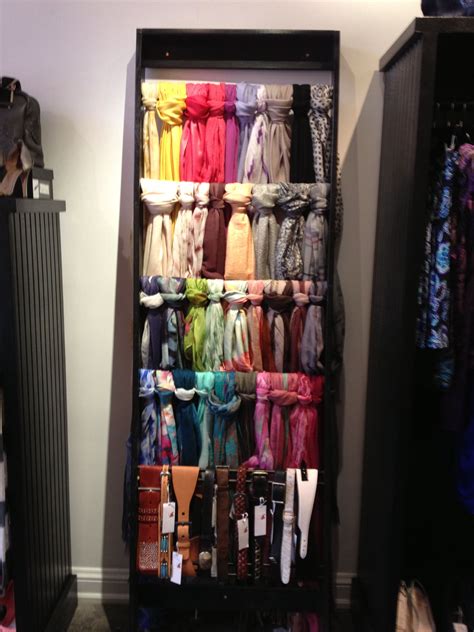 Great way to organize scarves and belts--build a ladder to display them ...