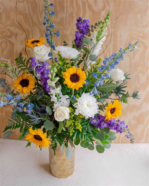 Daybreak | Sunflower floral arrangements, Blue flower arrangements, Summer flower arrangements