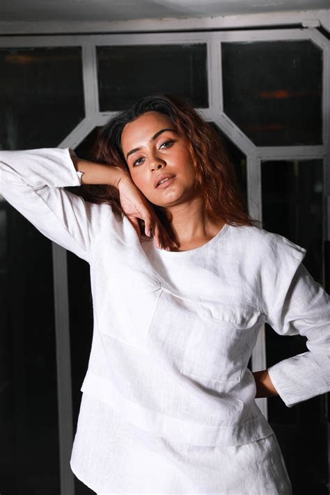 White linen co-ord set features a top with two pocket detailing and ma ...