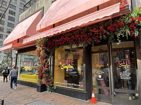 People stand in lines at an Upper East Side grocery store in New York.