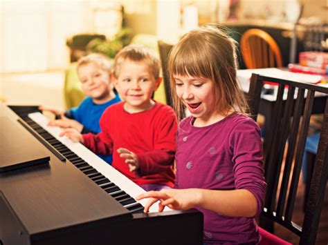 Young Children Playing Piano
