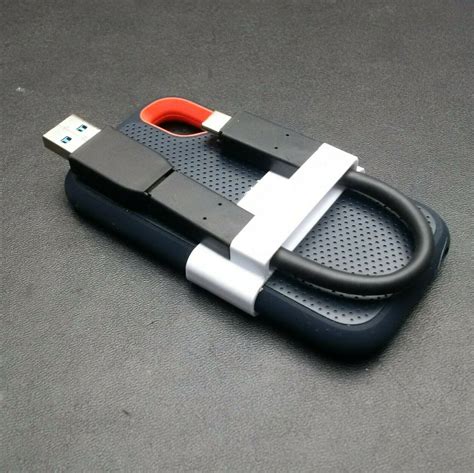 STL file sandisk extreme portable SSD holder for usb cable・3D printing ...