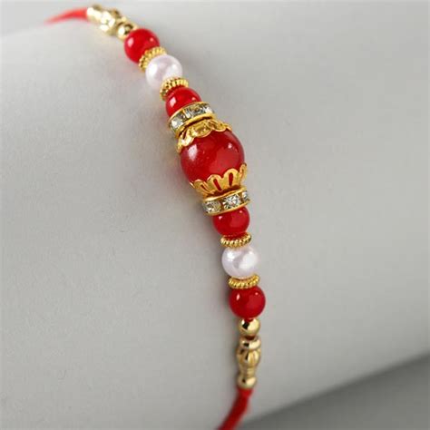 Send Beautiful Rakhi With 6 Pcs Rochers Online